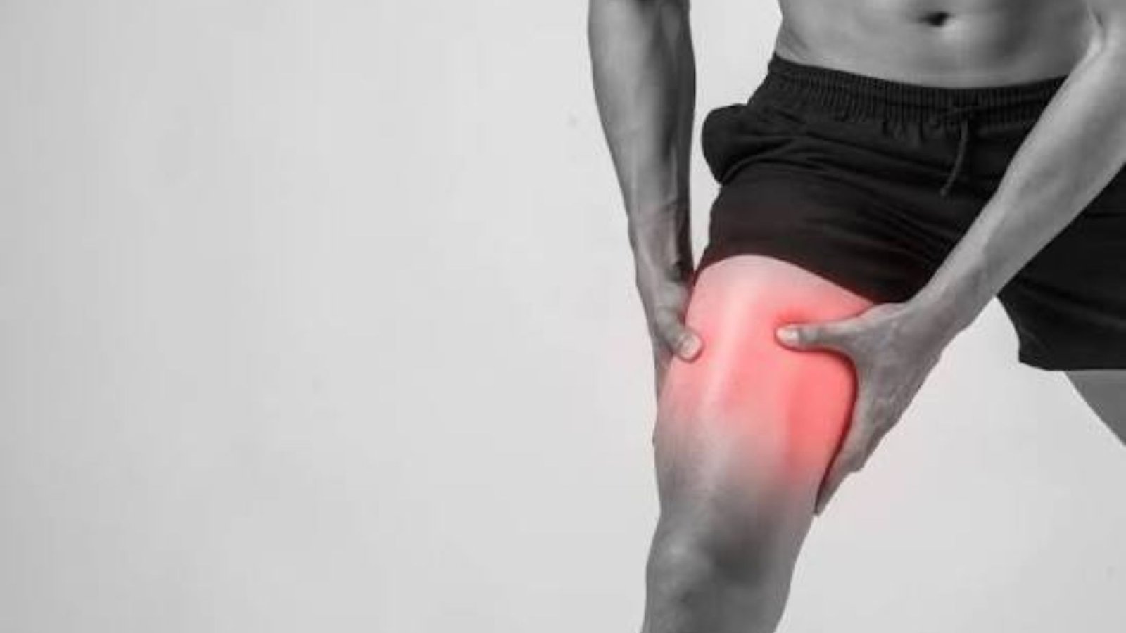 person holding a sore quadriceps with highlighted thigh pain after an intense squat workout.