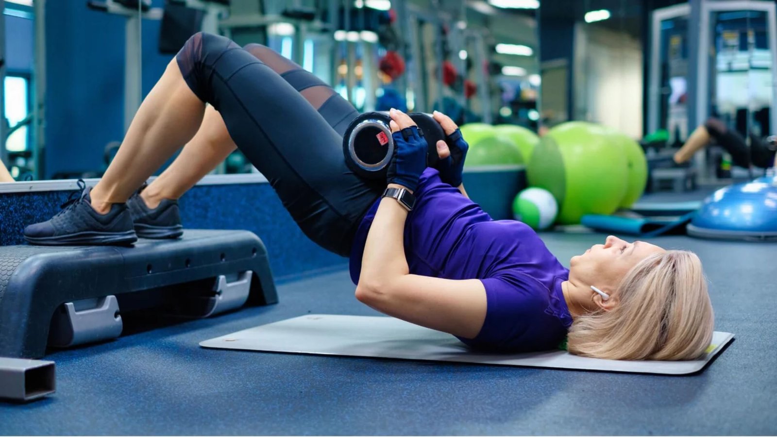 beginner performing a barbell hip thrust with proper form and glute engagement.