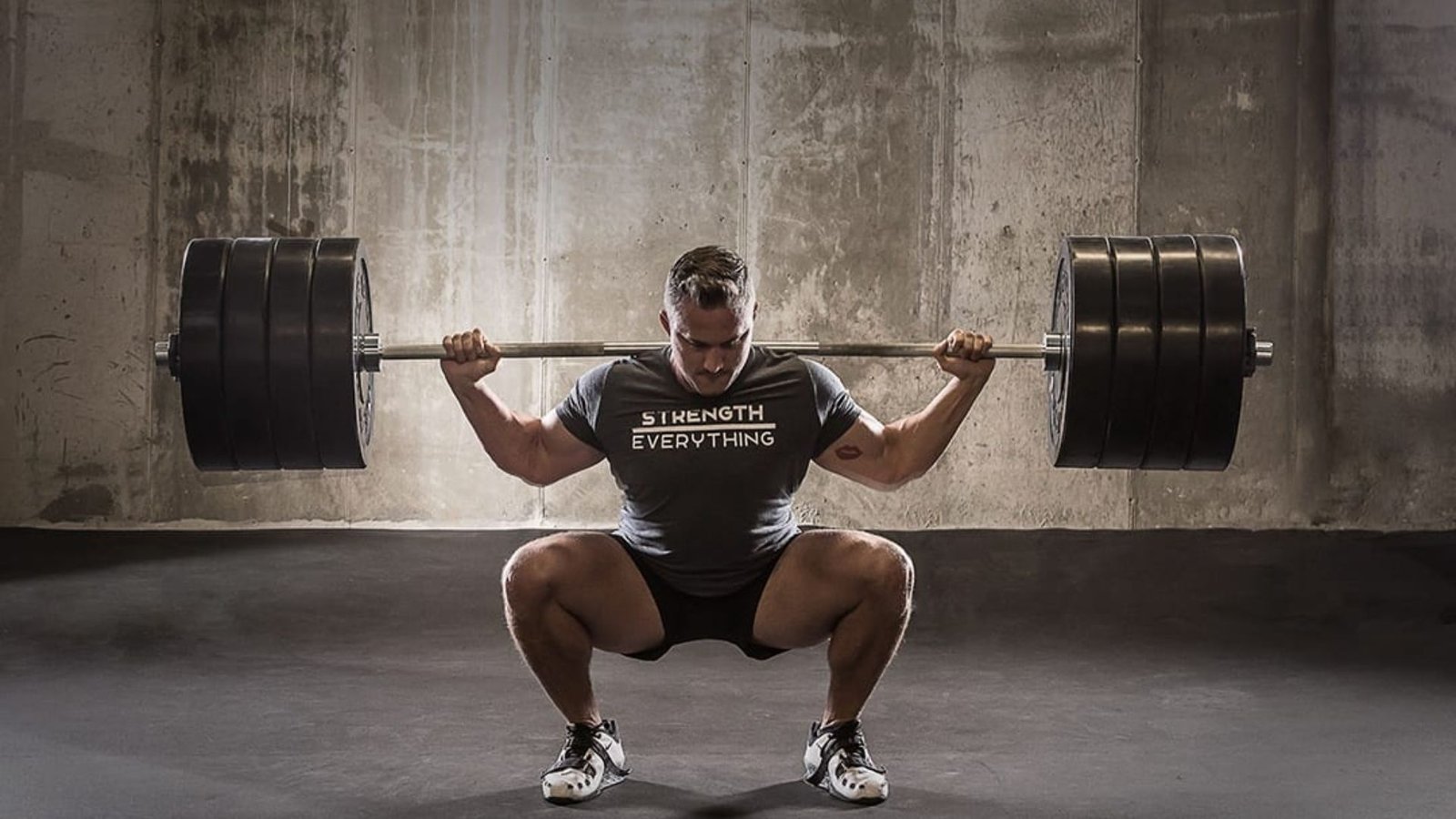 heavy barbell back squat performed in a deep position to build quad strength and improve knee stability.