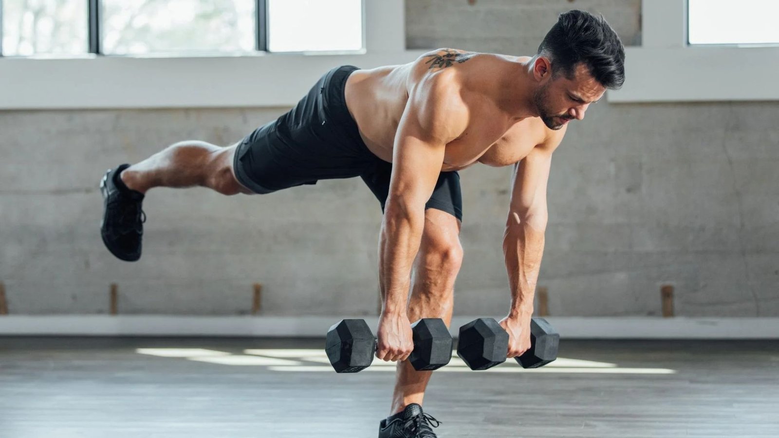 man performing a single-leg Romanian deadlift with proper balance.