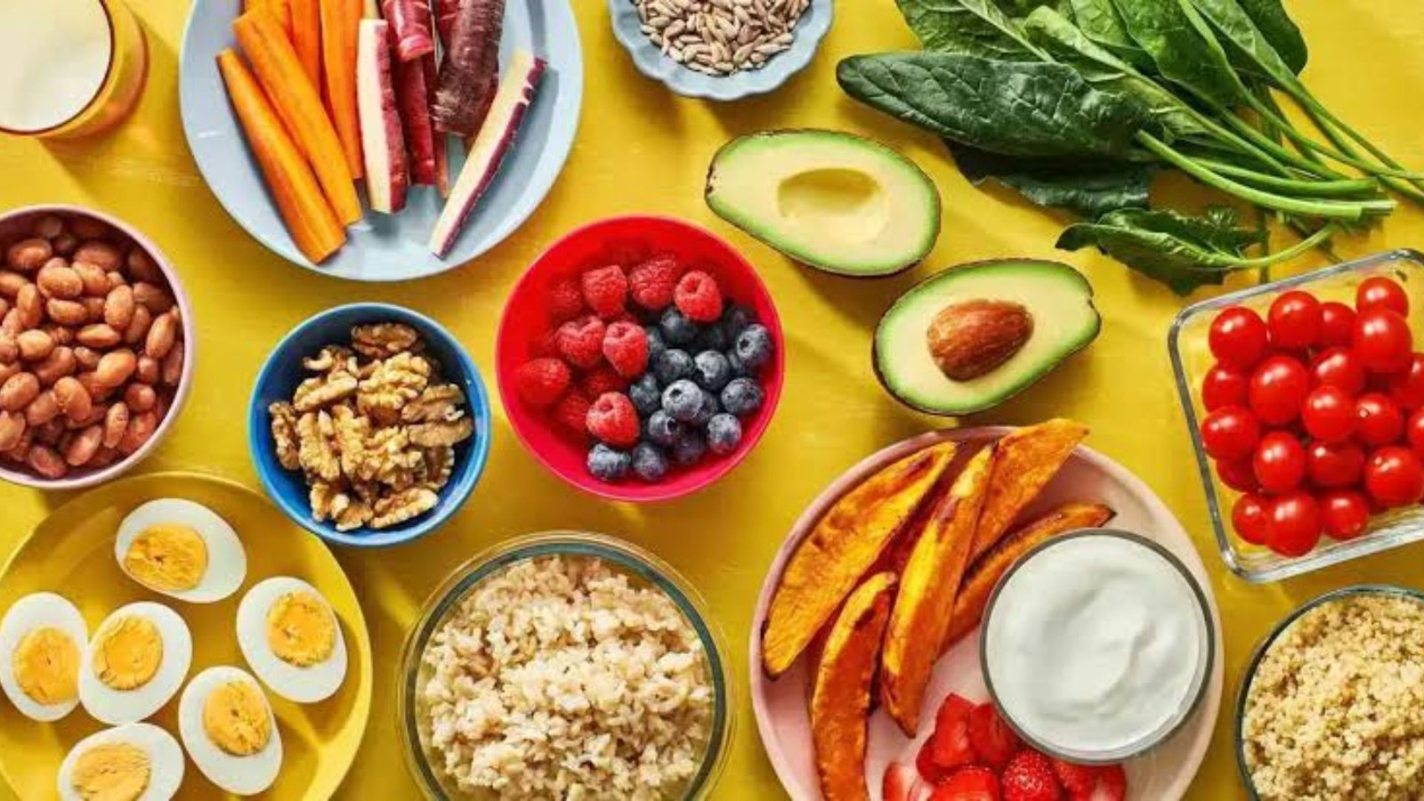 healthy foods including eggs, vegetables, berries, avocado, yogurt, and whole grains for weight loss.