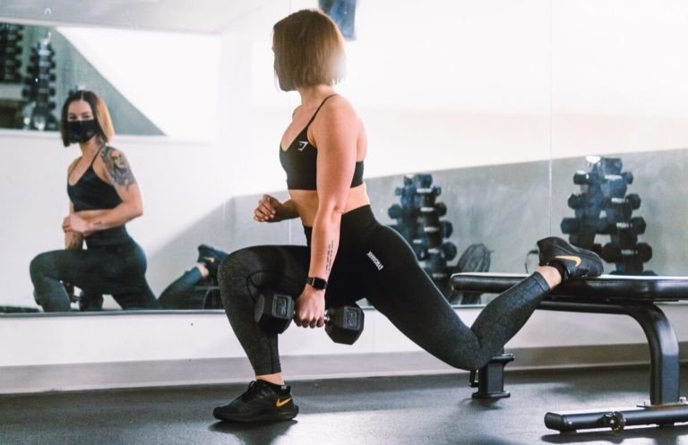 Woman performing exercise to train upper glutes