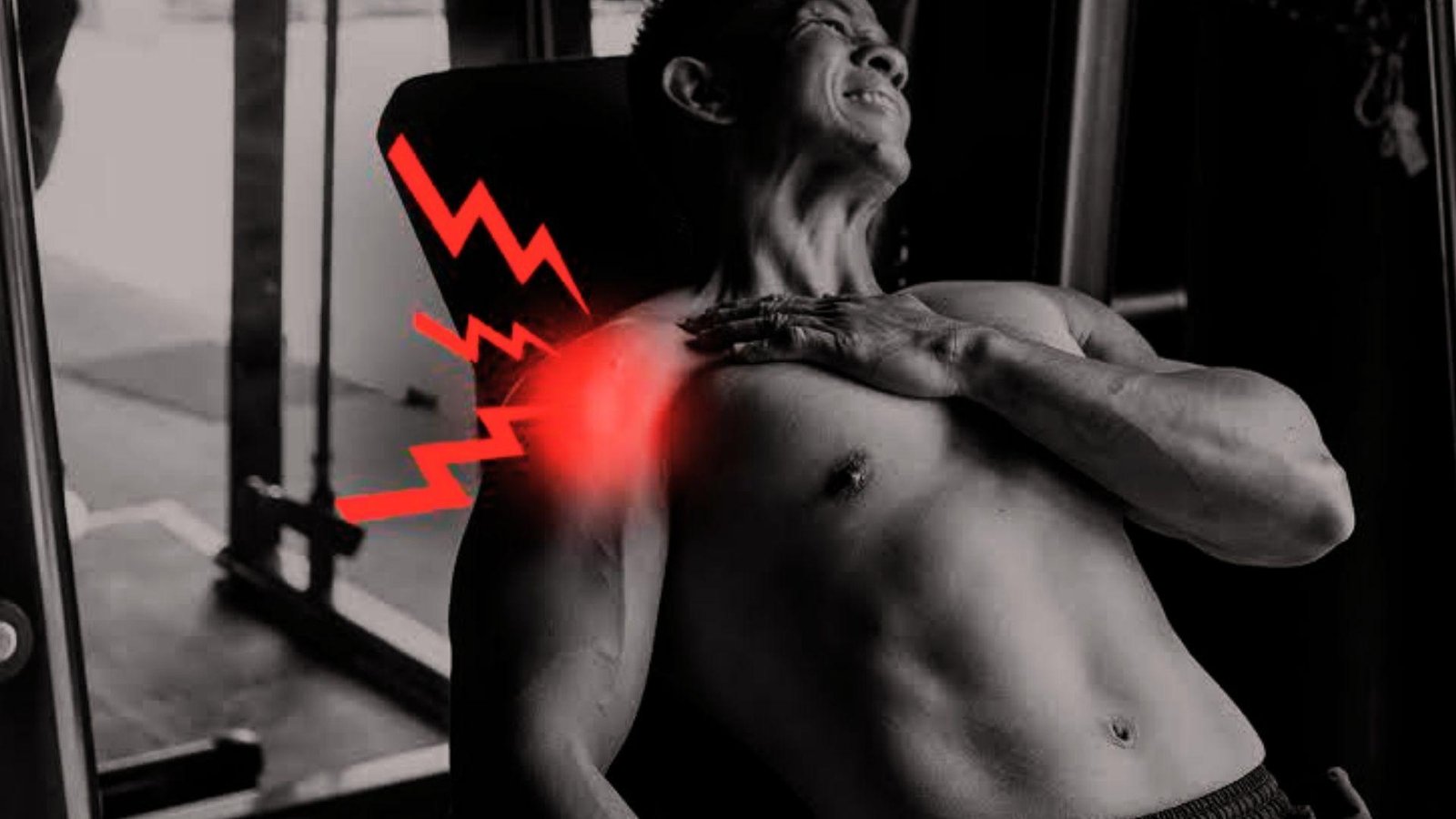 Shirtless man in gym grimacing and clutching shoulder with red pain glow and zigzag icons overlay.