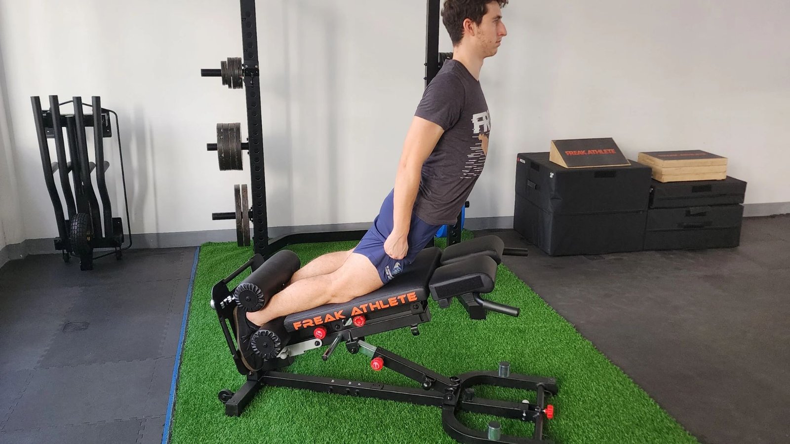 woman performing a Nordic hamstring curl with controlled movement.