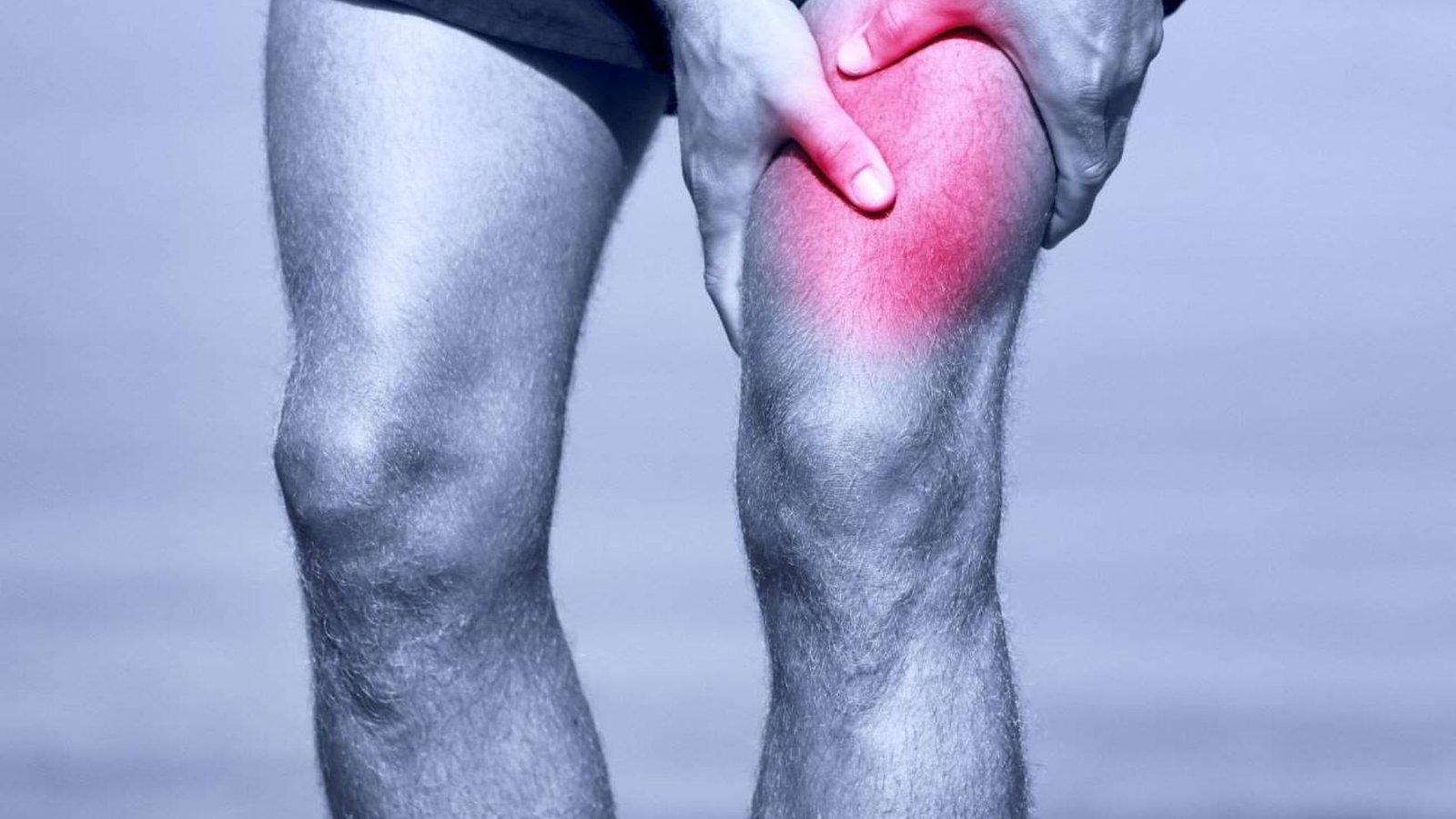 close-up of a painful knee with highlighted joint inflammation during movement or exercise.